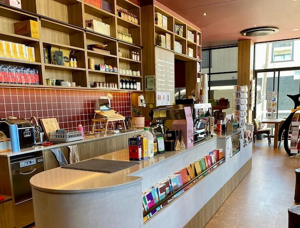 Timber shelving and counter joinery inside a bookshop and café fitout