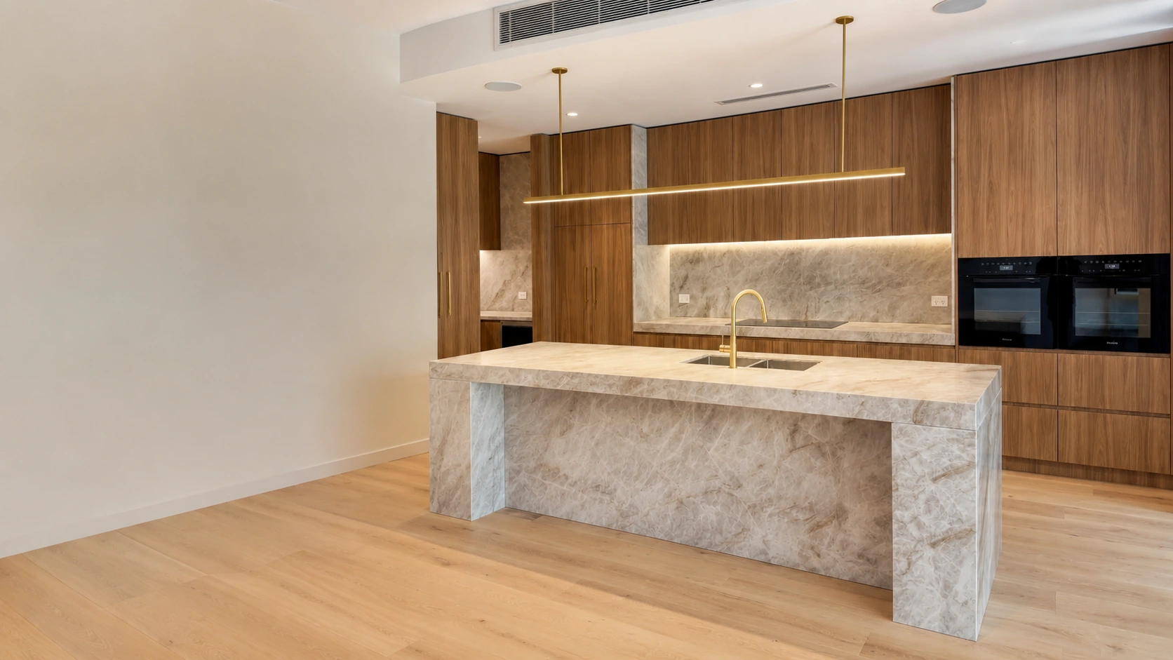 Timeless luxury kitchen with warm timber cabinetry and natural stone benchtop